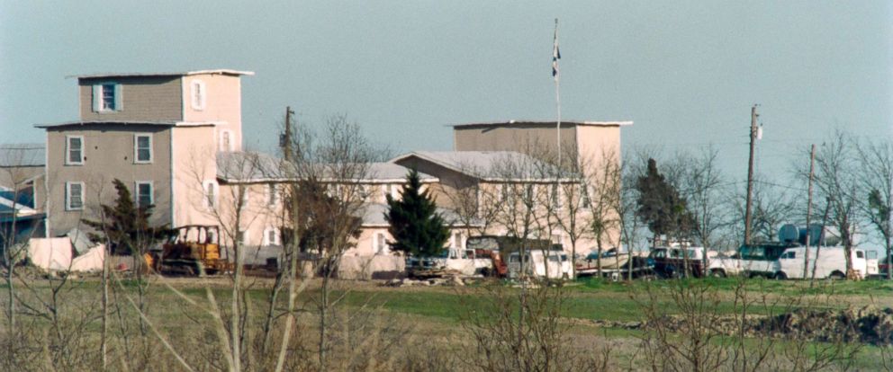 PHOTO: Various vehicles sit in front of the Branch Davidian religious compound in Waco, March 7, 1993, as the armed standoff between the religious cult and federal agents continued.